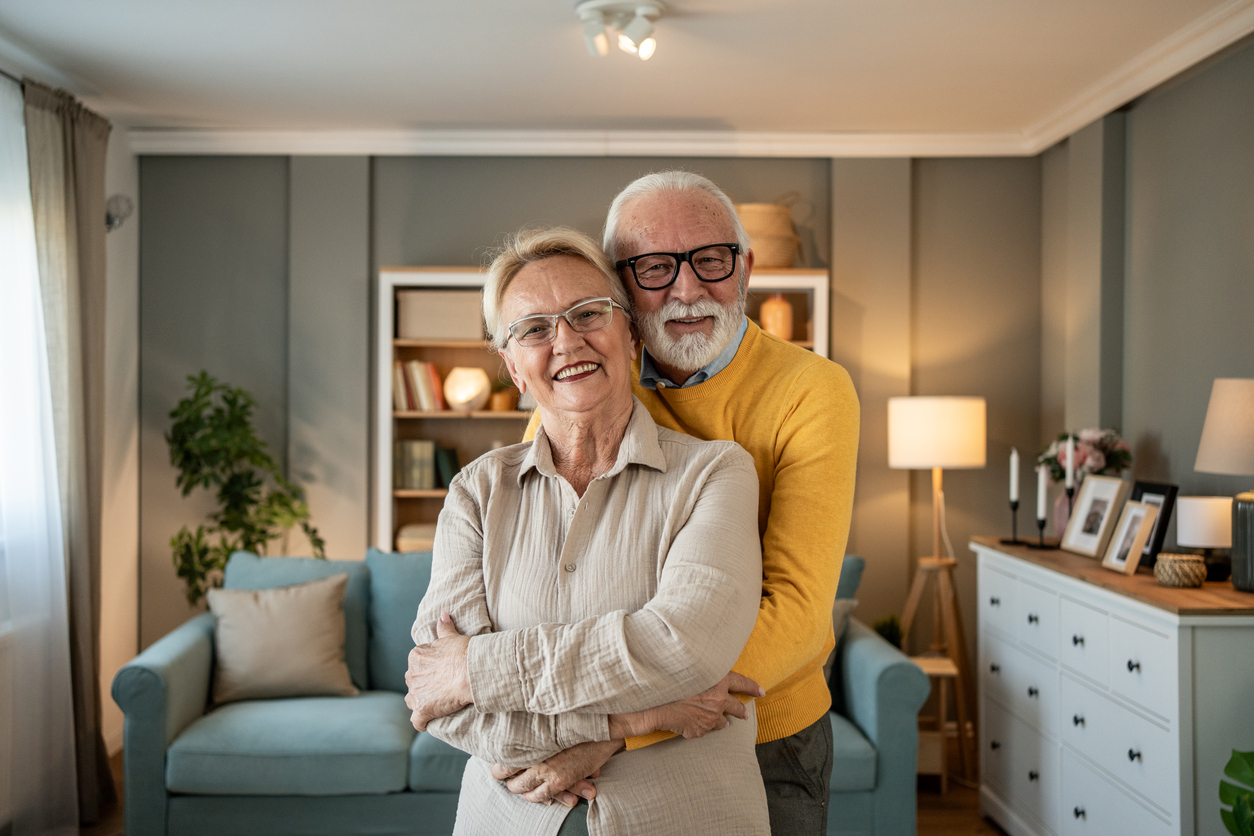 Happy elderly couple in comfortable home setting